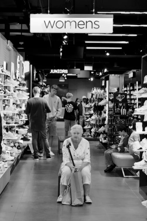 Peter Pickering sees an old lady waiting patiently inside a sports-shoe store