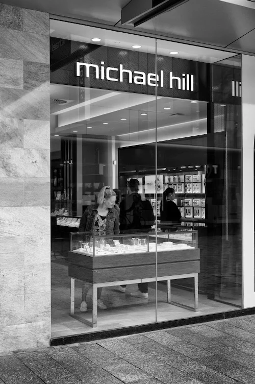 A woman in a jewellery store by the lens of Peter Pickering