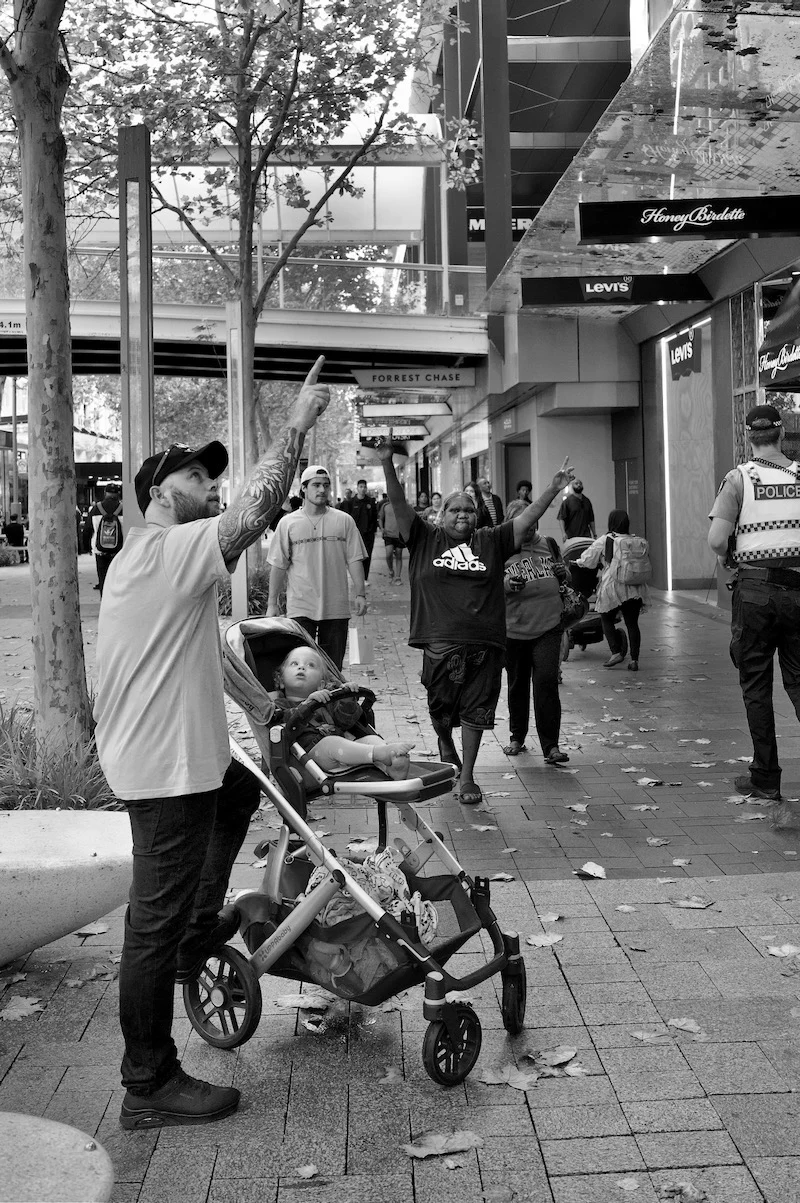 Street photographer Peter Pickering snaps the moment a father points out something to his child