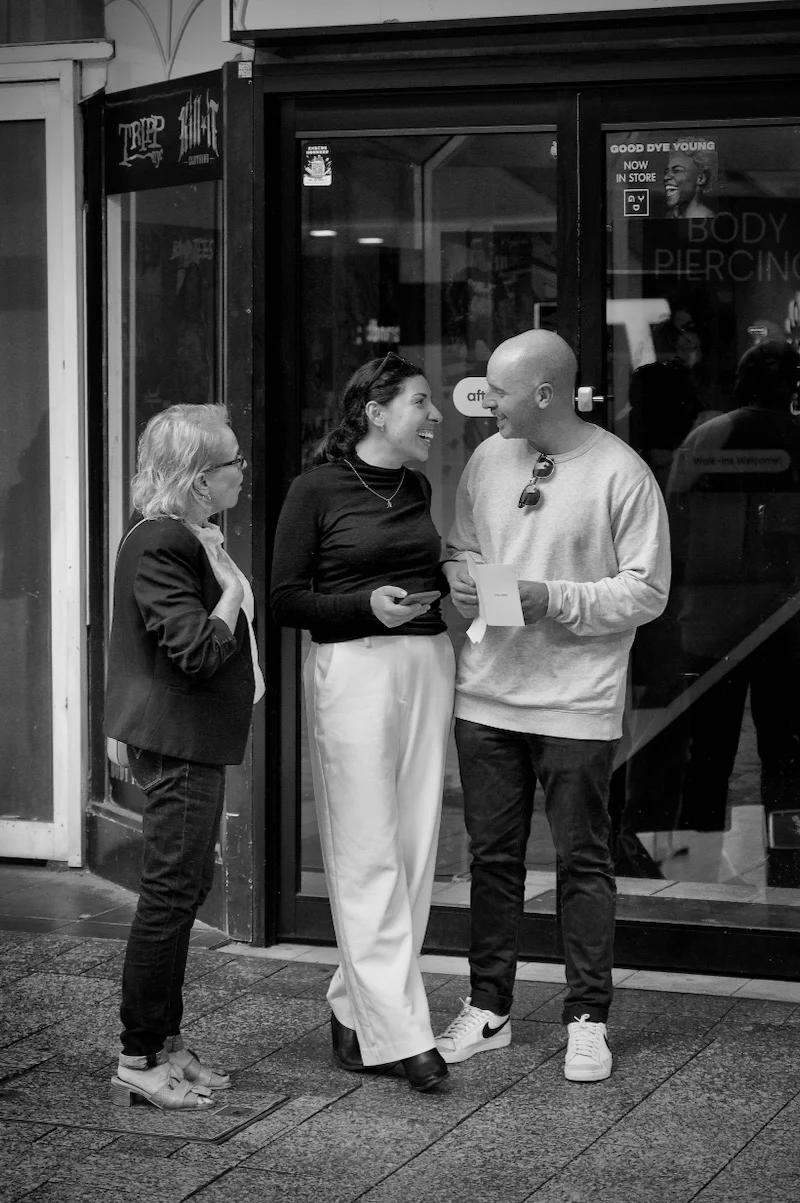 People chatting on the street captured by photographer Peter Pickering